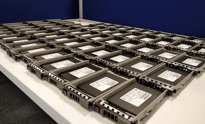 SSDs on a table, ready to be put in servers