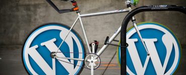 WordPress staging represented by two WordPress logos on cycle wheels