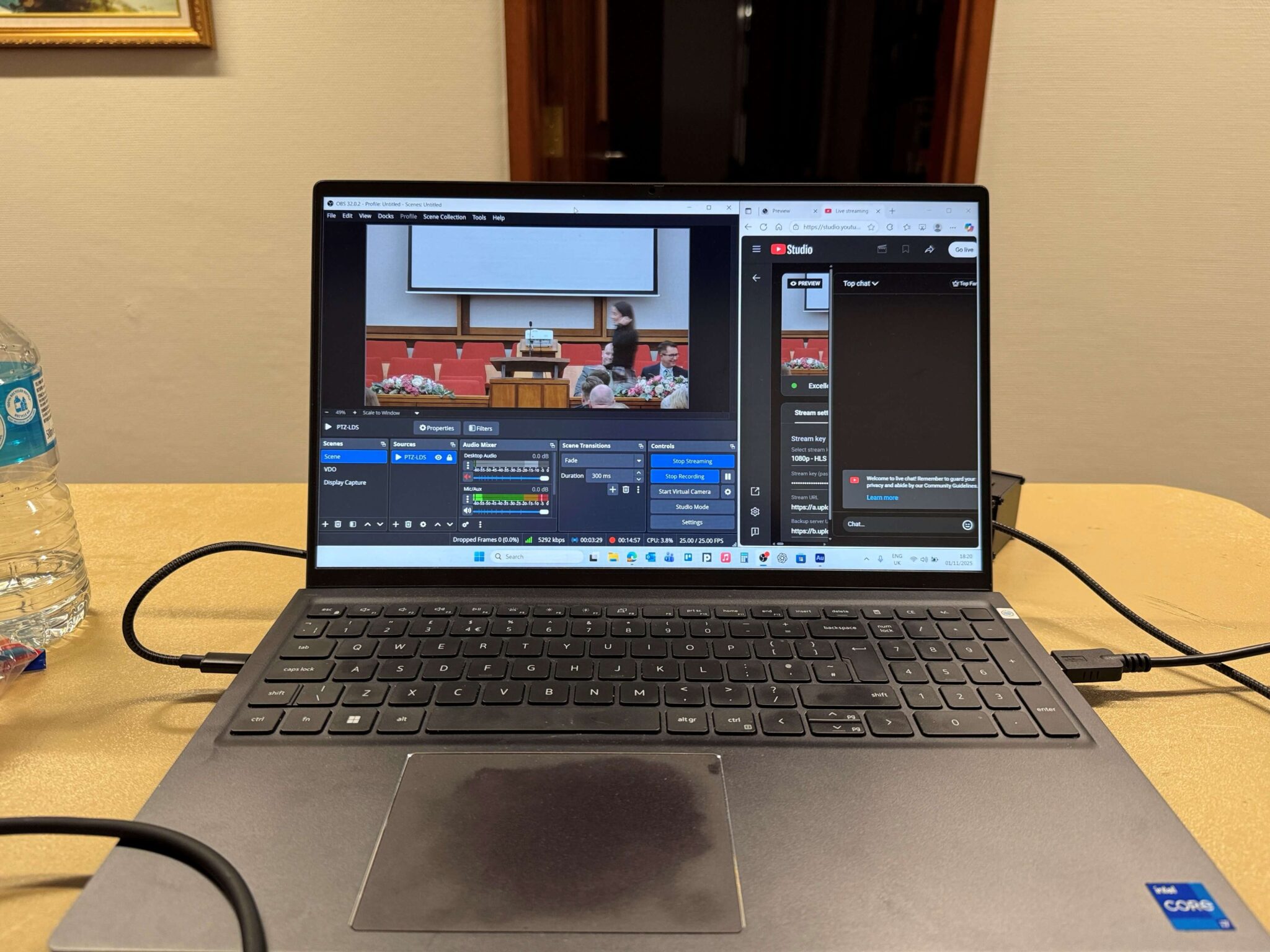 OBS being used on a laptop to stream a live conference event to YouTube